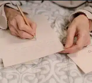 women writing letters