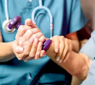 nurse assisting older person with weights