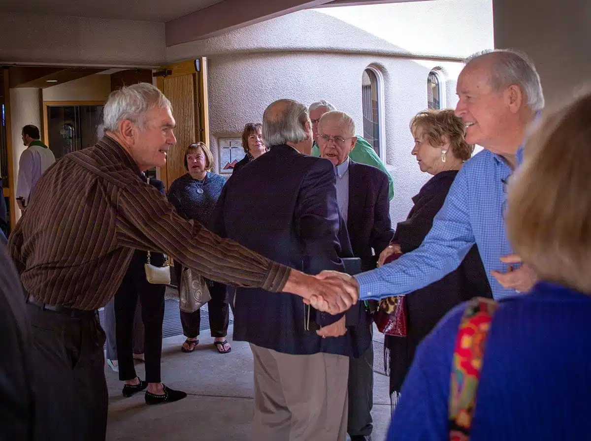 Members of DFLC shaking hands